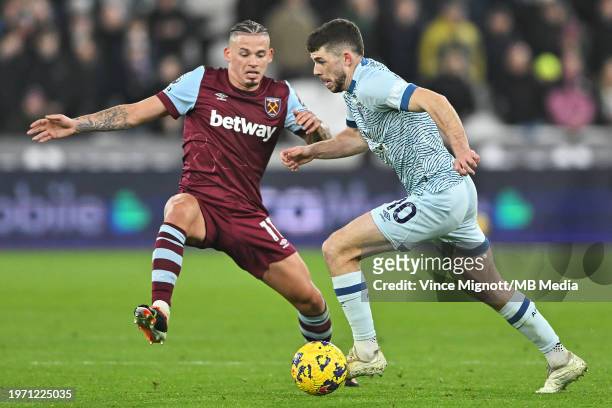 Kalvin Phillips of West Ham United and Ryan Christie of Bournemouth battle for the ball during the Premier League match between West Ham United and...