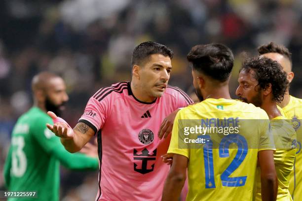 Inter Miami's Uruguayan forward Luis Suarez argues with Nassr's Saudi defender Nawaf Boushal and Saudi midfielder Abdulmajeed al-Sulayhem during the...