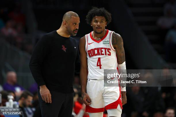 Houston Rockets head coach Ime Udoka speaks with Jalen Green during the second half of the game against the Charlotte Hornets at Spectrum Center on...