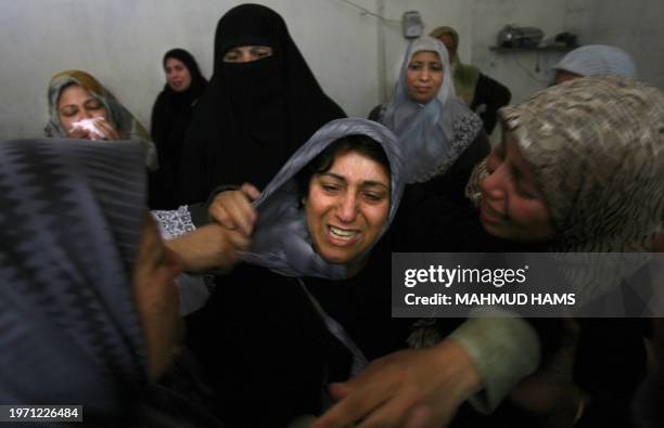 Mother of Arafat Zarandh who was killed yesterday by Israeli artillery shelling, mourns during the funeral of her son in Gaza City, 27 May 2006. Four...