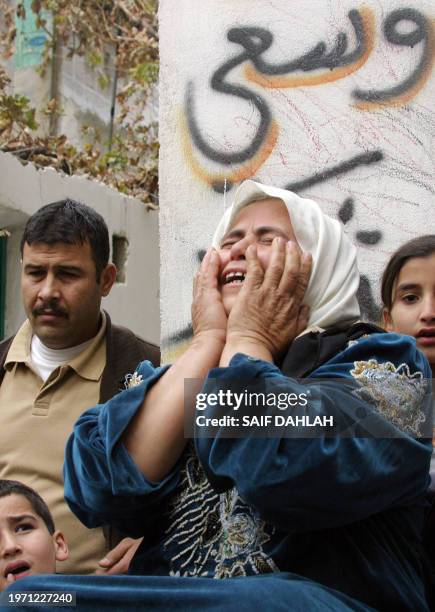 The mother of Palestinian suicide bomber 21-year-old Lotfi Amine Abu Saada grieves upon hearing the news that he son was the suicide bomber who...