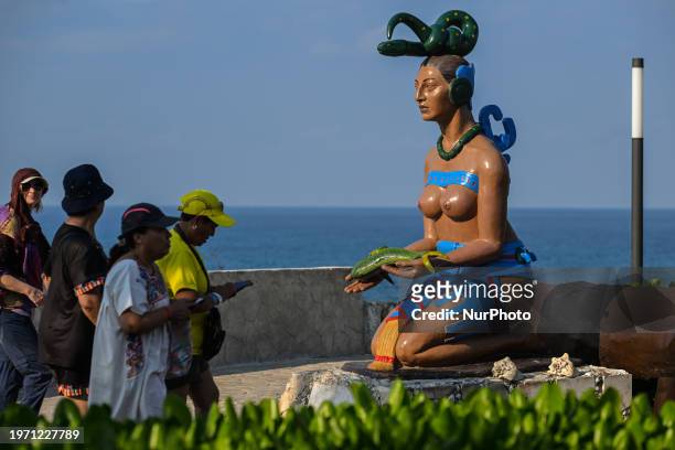 One of many statues located in Punta Sur, in the southern tip of Isla Mujeres, roughly 60 feet above sea level, where the rising sun first touches...