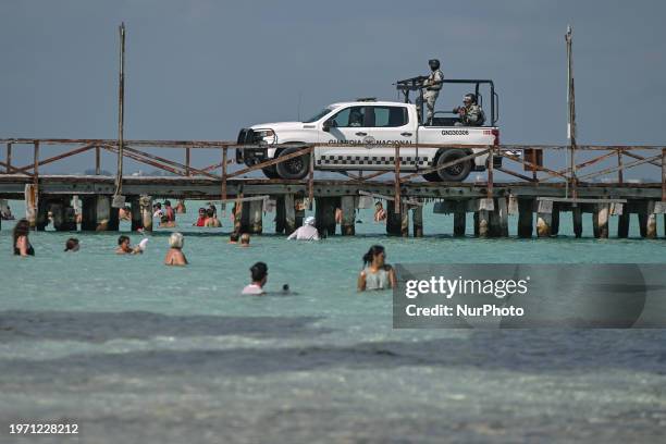 Members of the National Guard patrolling the beachside in Isla Mujeres, on December 5 in Isla Mujeres, Quintana Roo, Mexico.