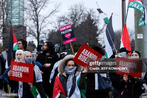 People gather in support of Palestinians outside of the venue where US President Joe Biden is speaking to members of the United Auto Workers at the...