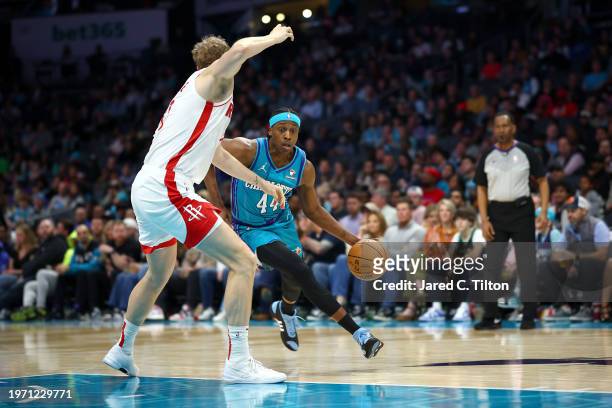 Frank Ntilikina of the Charlotte Hornets drives to the basket during the second half of the game against the Houston Rockets at Spectrum Center on...