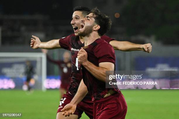 Venezuela's midfielder Carlos Faya and forward Matias Lacava celebrate an own goal scored by Brazil's defender Rikelme during the Venezuela 2024...