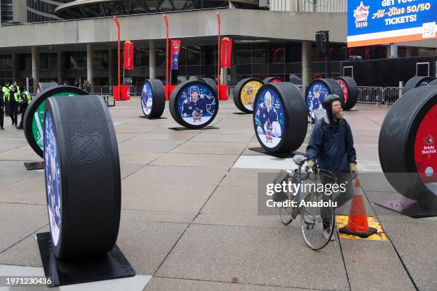 Giant hockey pucks with pictures of 2024 NHL All-Star players are seen ahead of 2024 NHL All-Star Weekend festivities at the Nathan Phillips Square...