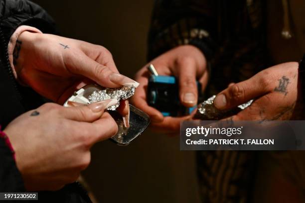 "Jae" and her boyfriend prepare to use fentanyl following the decriminalization of all drugs in downtown Portland, Oregon on January 23, 2024. When...