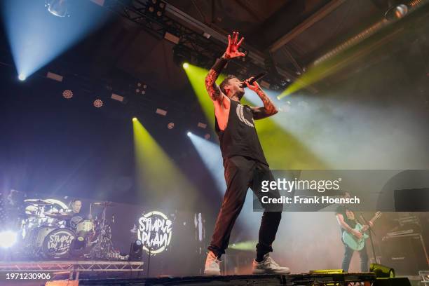 Chuck Comeau, Pierre Bouvier and Sebastien Lefebvre of the Canadian band Simple Plan perform live on stage during a concert at the Columbiahalle on...