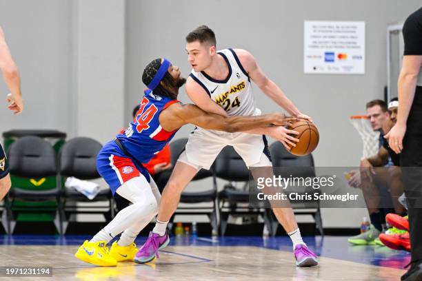 Kyle Mangas of the Indiana Mad Ants handles the ball against Zavier Simpson of the Motor City Cruise during the first quarter of the game on February...