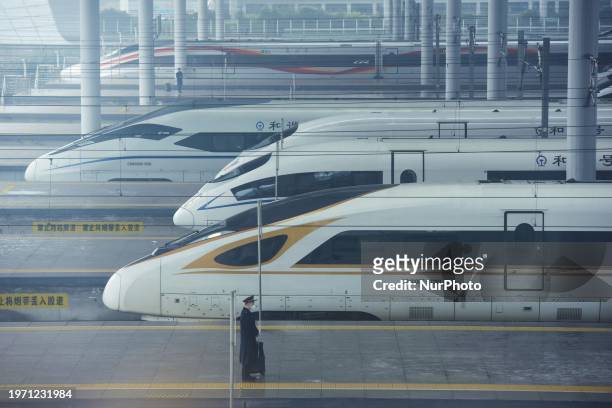 Multiple high-speed trains are about to depart from Hangzhou East Railway Station with passengers on board in Hangzhou, Zhejiang Province, China, on...