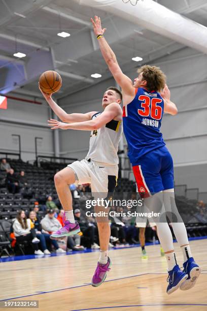 Kyle Mangas of the Indiana Mad Ants drives to the basket against Jayce Johnson of the Motor City Cruise during the fourth quarter of the game on...