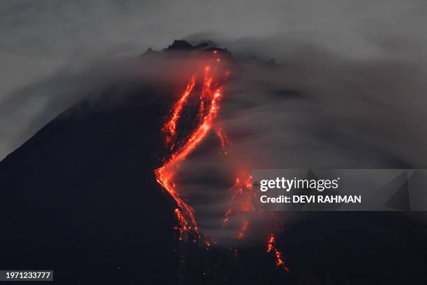 Glowing lava is seen on the slopes of Mount Merapi from Srumbung, Central Java, on February 1, 2024.