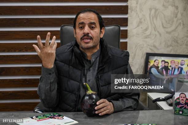 This photograph taken on January 26, 2024 shows Aamir Mughal, member of Pakistan Tehreek-e-Insaf party and an independent election candidate for...