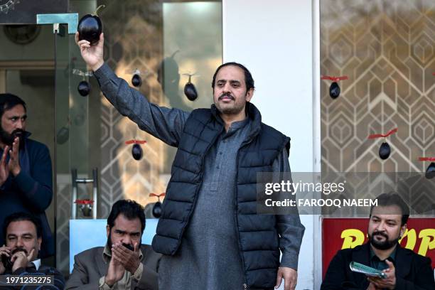 This photograph taken on January 26, 2024 shows Aamir Mughal , member of Pakistan Tehreek-e-Insaf party and an independent election candidate for the...