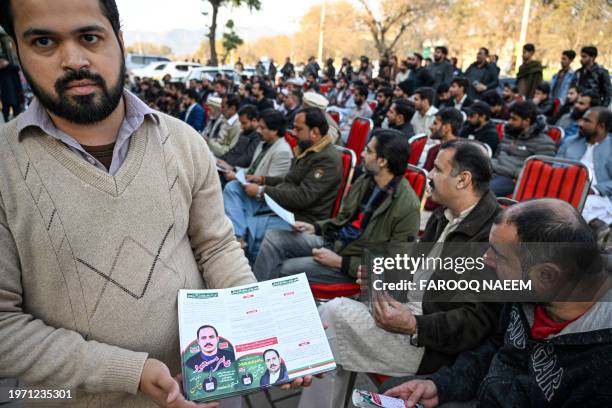 This photograph taken on January 26, 2024 shows a supporter of Aamir Mughal, member of Pakistan Tehreek-e-Insaf party and an independent election...