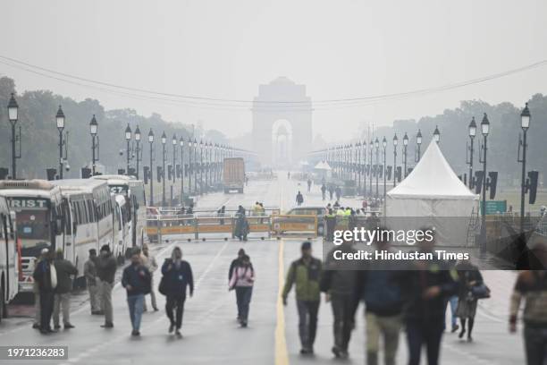 People seen out during light drizzle and cold breeze at Kartavya Path on February 1, 2024 in New Delhi, India.