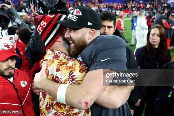 Travis Kelce of the Kansas City Chiefs celebrates with his brother Jason Kelce after a 17-10 victory against the Baltimore Ravens in the AFC...