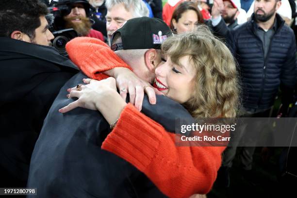 Travis Kelce of the Kansas City Chiefs celebrates with Taylor Swift after a 17-10 victory against the Baltimore Ravens in the AFC Championship Game...