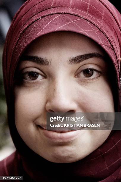 Picture taken 03 April 2006 in Copenhagen shows Muslim Asmaa Abdol-Hamid, a co-host in a weekly television programme "Adam and Asmaa" on the DR2...