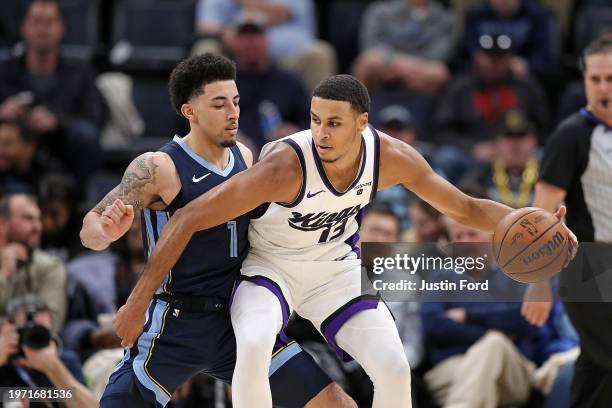 Keegan Murray of the Sacramento Kings posts up against Scotty Pippen Jr. #1 of the Memphis Grizzlies during the second half at FedExForum on January...