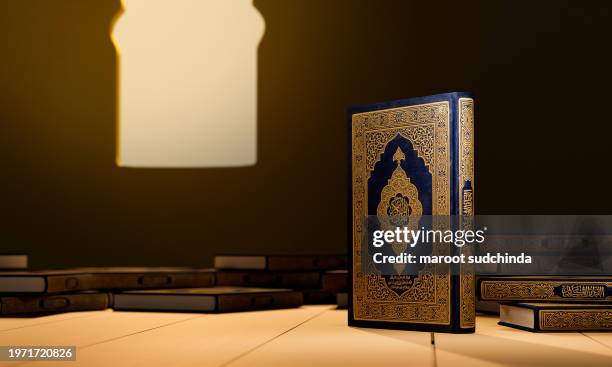 3d, many qurans on the wooden table, islamic concept - the holy al quran with written arabic calligraphy meaning of al quran - arabic calligraphy stock pictures, royalty-free photos & images