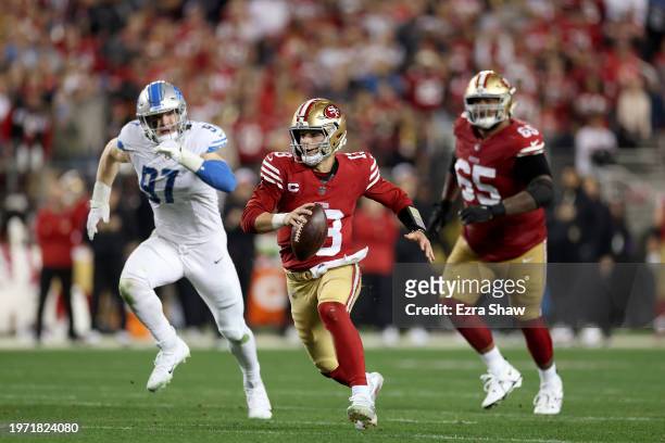 Brock Purdy of the San Francisco 49ers scrambles with the ball against the Detroit Lions in the NFC Championship Game at Levi's Stadium on January...