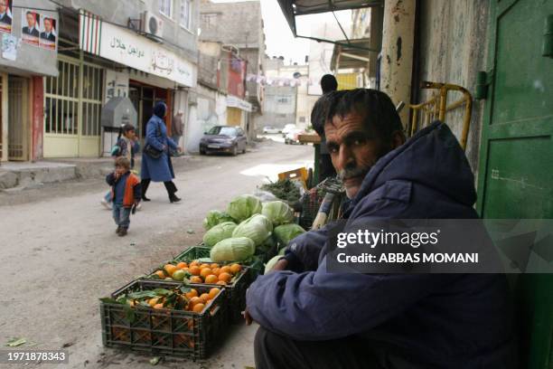 Palestinian child walks in the street at the Amari refugee camp in south of the West Bank city of Ramallah 29 December 2004. Al-Amari refugee camp...