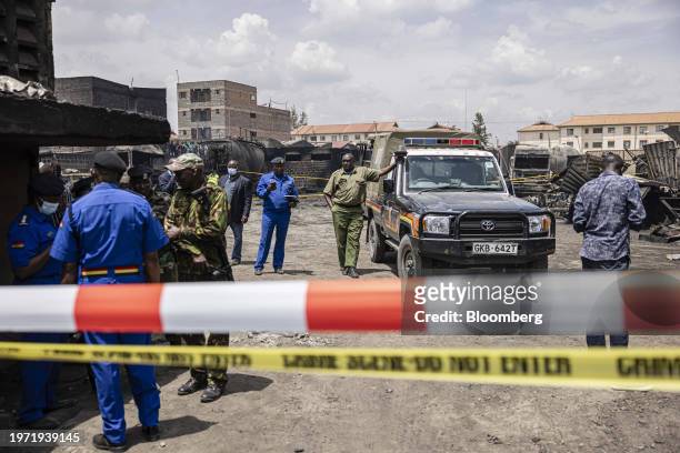 Kenyan police officers guard the site of an explosion in the Embakasi district of Nairobi, Kenya, on Friday, Feb. 2, 2024. A vehicle loaded with gas...