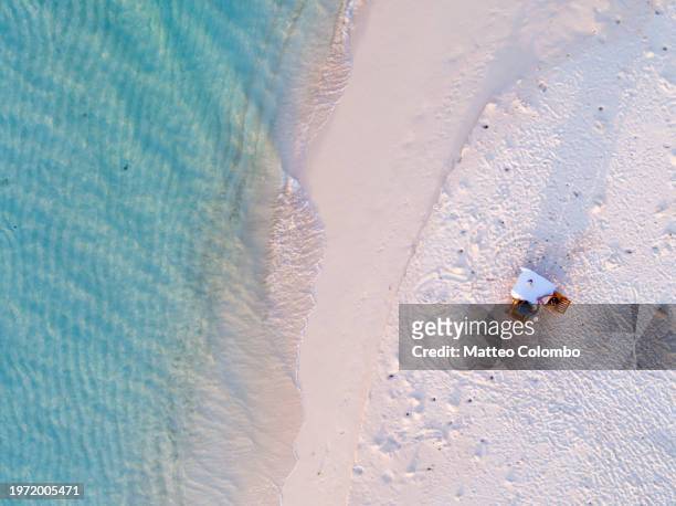 aerial view of couple eating dinner on the beach - ari atoll stock pictures, royalty-free photos & images