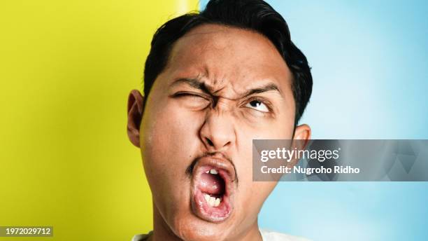 close up of ugly face with crossing lips - yelling stock pictures, royalty-free photos & images