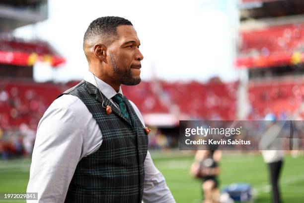 Fox Sports broadcaster Michael Strahan walks onto the field prior to the NFC Championship NFL football game between the San Francisco 49ers and the...