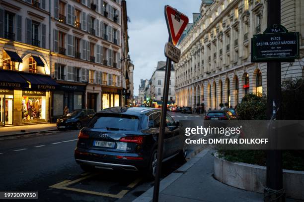Cars are parked in Paris city centre on February 1, 2024 as Paris' city hall is organising a vote on February 4 on the creation of a special parking...