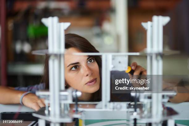 young female scientist working on a project in laboratory. - school science project stock pictures, royalty-free photos & images