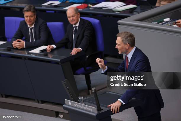 German Federal Finance Minister Christian Lindner speaks during debates about the 2024 federal budget as Chancellor Olaf Scholz and Economy and...