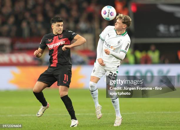 Nadiem Amiri of Bayer and Robin Hack of Mönchengladbach battle for the ball during the Bundesliga match between Bayer 04 Leverkusen and Borussia...