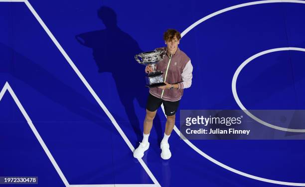Jannik Sinner of Italy poses with the Norman Brookes Challenge Cup during the official presentation after their Men's Singles Final match against...