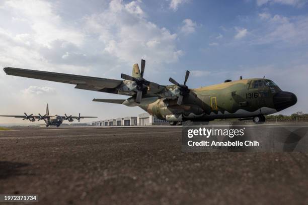 Taiwan Air Force Lockheed C-130 Hercules aircrafts taxi at the runway during Taiwan Air Force's take-off and landing drills inside an airbase on...