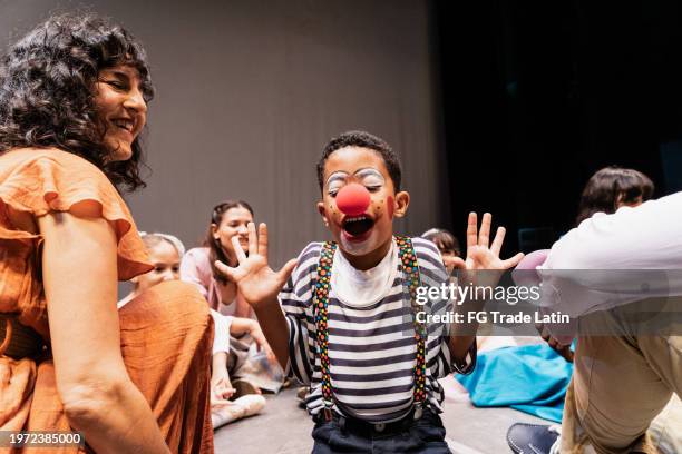 child clown boy preparing to performance at stage theater - industria teatrale foto e immagini stock