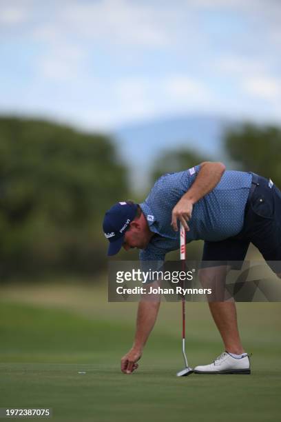 Jean Hugo of South Africa repairs a pitch mark during day two of the SDC Open at Zebula Golf Estate & Spa on February 2, 2024 in Limpopo, South...