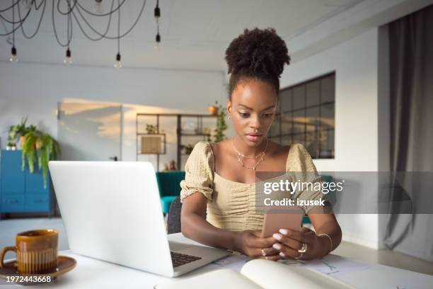 worried woman using smart phone in an office - network failure stock pictures, royalty-free photos & images