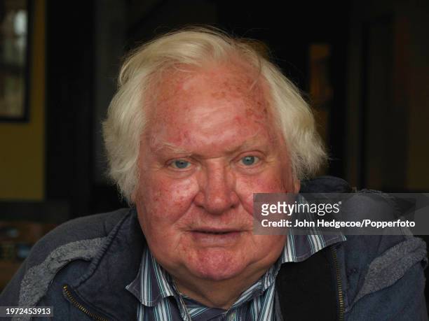 English film director and photographer Ken Russell posed in a surviving room of his fire damaged cottage in the village of East Boldre in the New...