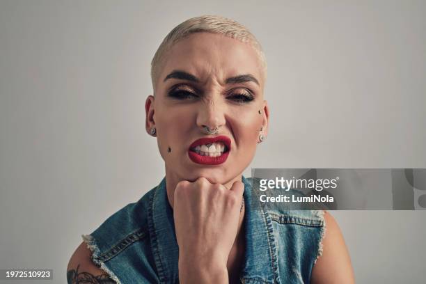 makeup, attitude and portrait of woman in studio for trendy, creative and stylish fashion. grunge aesthetic, cosmetic and young female person with edgy style and bold face routine by gray background. - alternative rock stock pictures, royalty-free photos & images