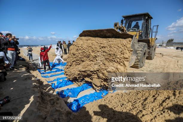 Mass grave containing the bodies of Palestinians killed during the war are buried on January 30, 2024 in Rafah, Gaza. The health ministry in Gaza...
