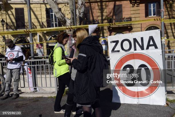 People with banners and placards protest for a new highway code that introduces the ban on exceeding 30 km per hour in the city, on February 2, 2024...