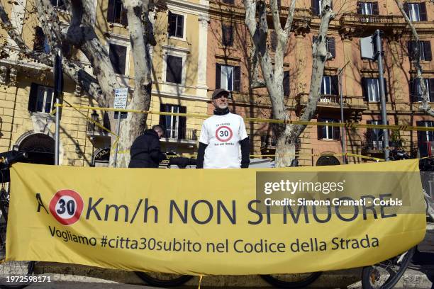 People with banners and placards protest for a new highway code that introduces the ban on exceeding 30 km per hour in the city, on February 2, 2024...