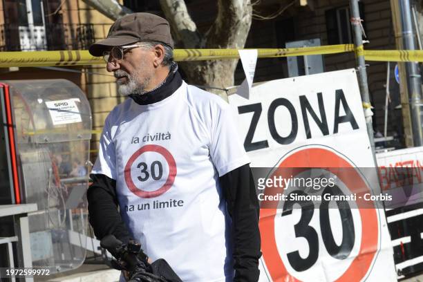 People with banners and placards protest for a new highway code that introduces the ban on exceeding 30 km per hour in the city, on February 2, 2024...
