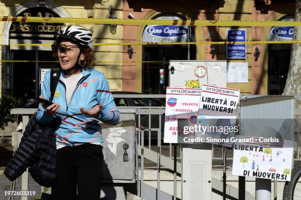 People with banners and placards protest for a new highway code that introduces the ban on exceeding 30 km per hour in the city, on February 2, 2024...