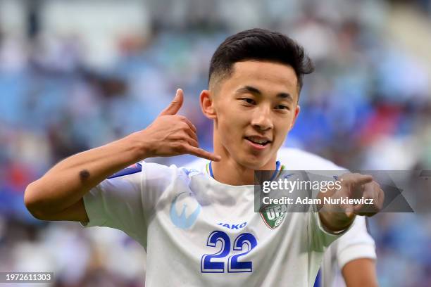 Abbosbek Fayzullaev of Uzbekistan celebrates scoring their second goal during the AFC Asian Cup Round of 16 match between Uzbekistan and Thailand at...