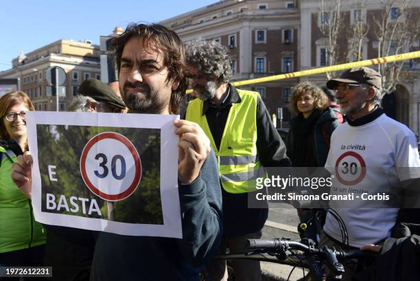 People with banners and placards protest for a new highway code that introduces the ban on exceeding 30 km per hour in the city, on February 2, 2024...